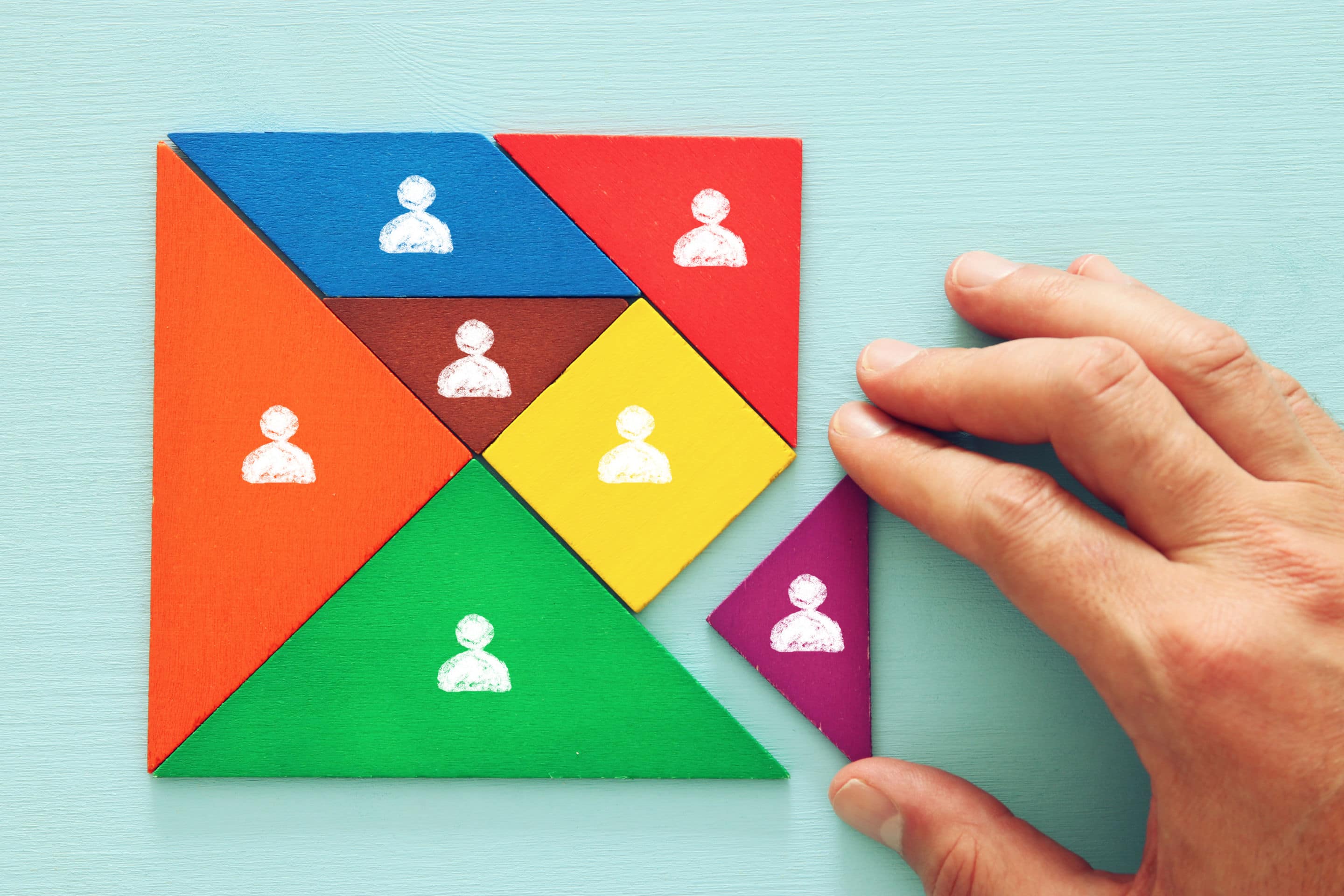 tangram puzzle blocks with people icons ,human resources and management concept.